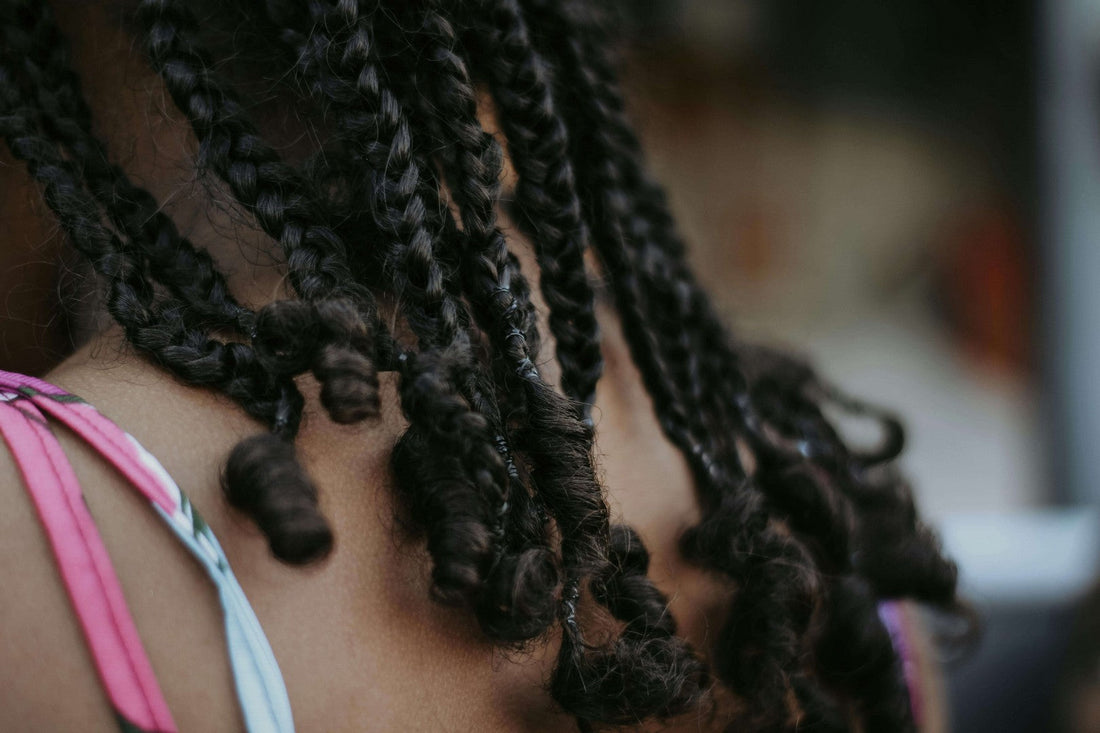 Close-up of spring twist hairstyle showing defined twisted braids at the nape of the neck.